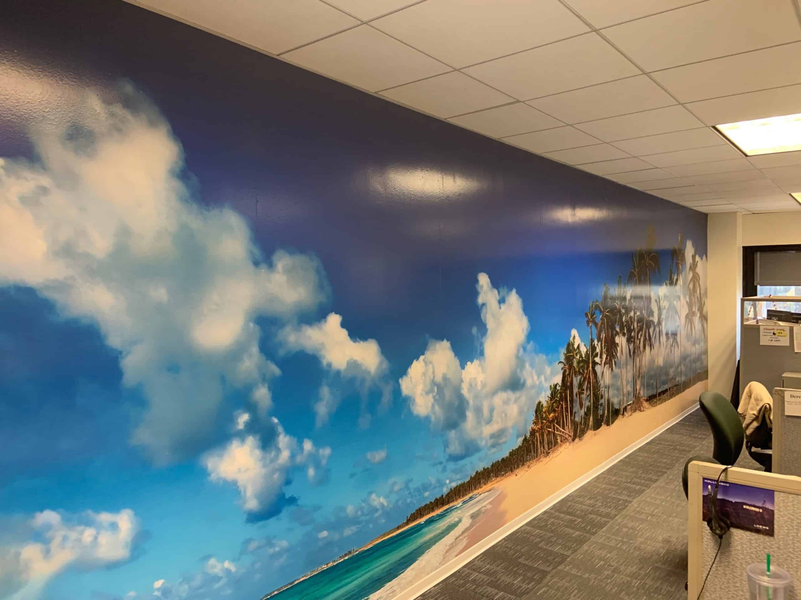 IMG_1149 a large mural of a beach on a wall.