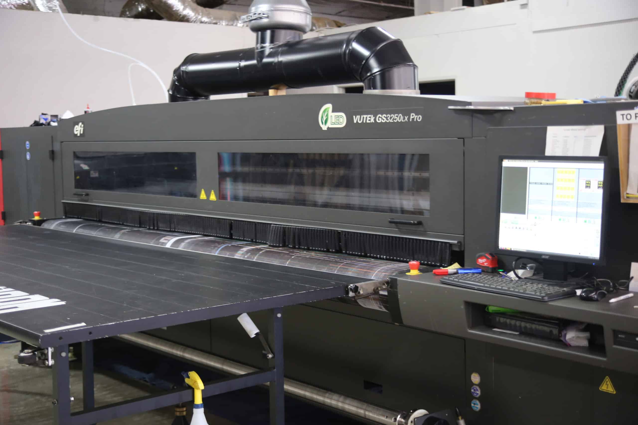 a large machine with a computer on top of it.