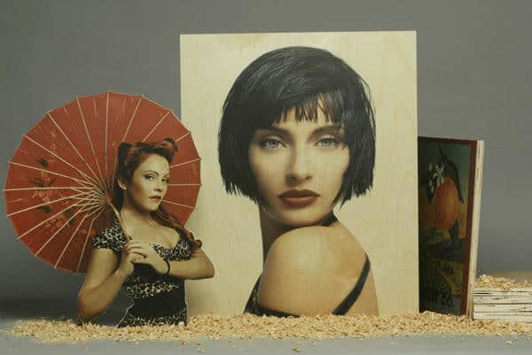 Picture of women using flat bed priting Pictures of women using flat bed printing done by Platon Graphics
