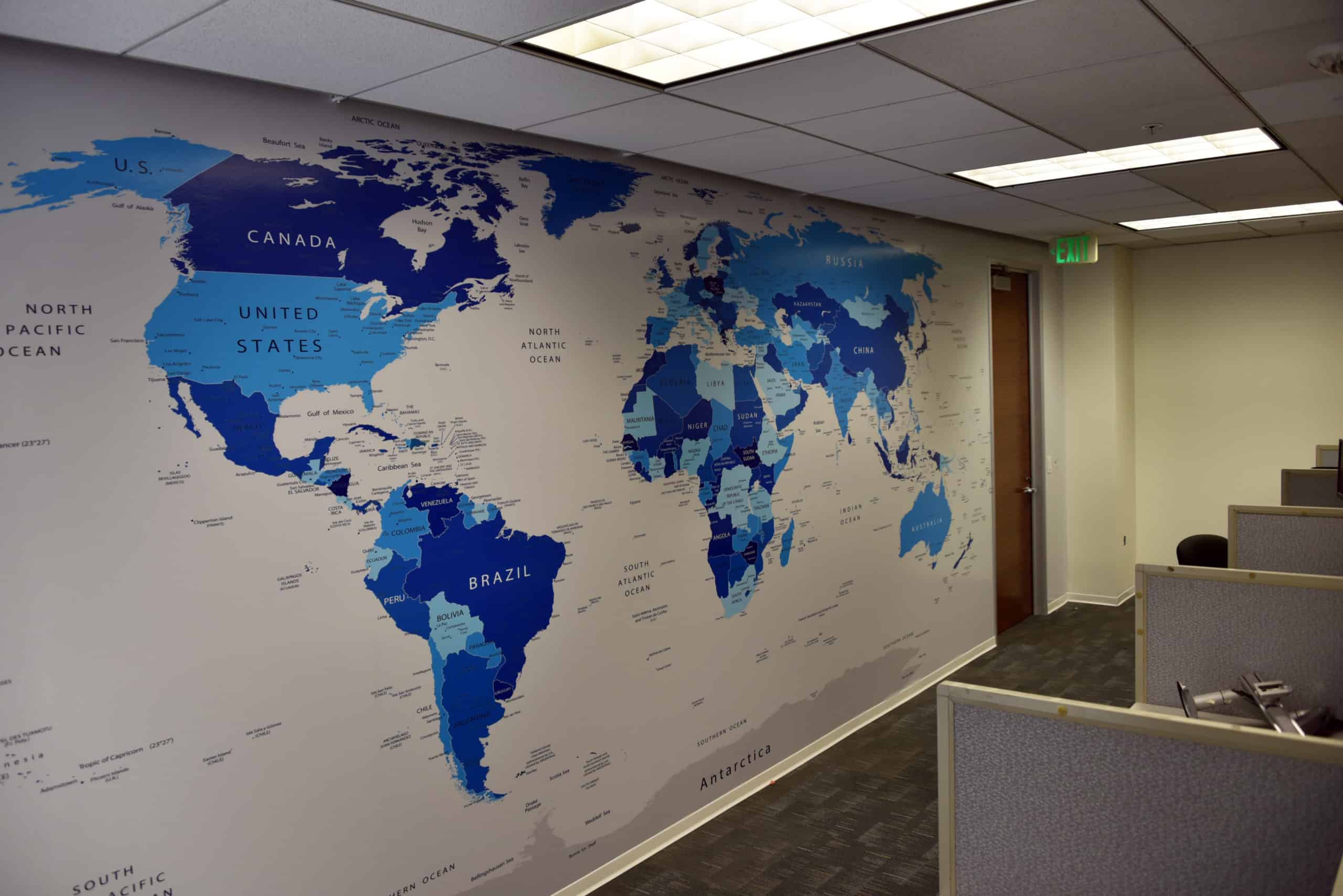 World map a map of the world on a wall in an office.