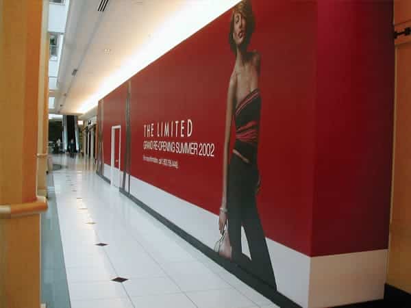 Huge barricade display for The Limited This huge barricade display creates a compelling image and brand for The Limited. With Platon’s proprietary signage systems there is literally “no limit” to the size of your barricade display.