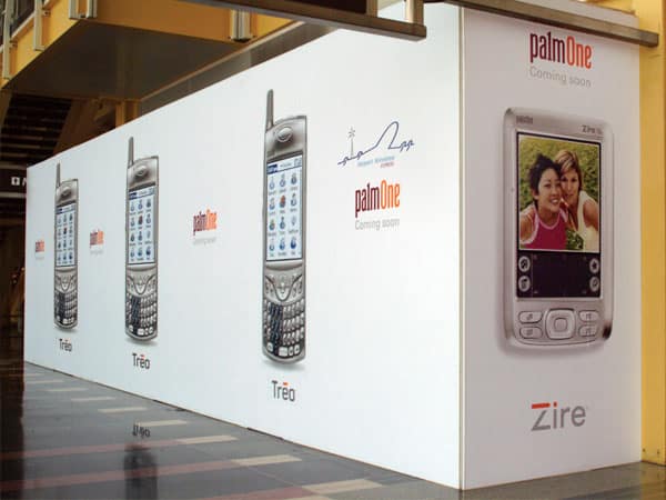 Palm One barricade display A creative barricade can be a fabulous way to communicate your new product selection like this display created for Palm. They were able to create demand and interest for their new Zire and Treo models before the store even opened!