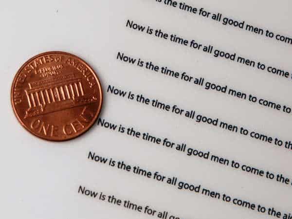 Small sentences made through UV Curving Printing Small extremely clear sentences made through UV Curing Printing with a penny for scale.