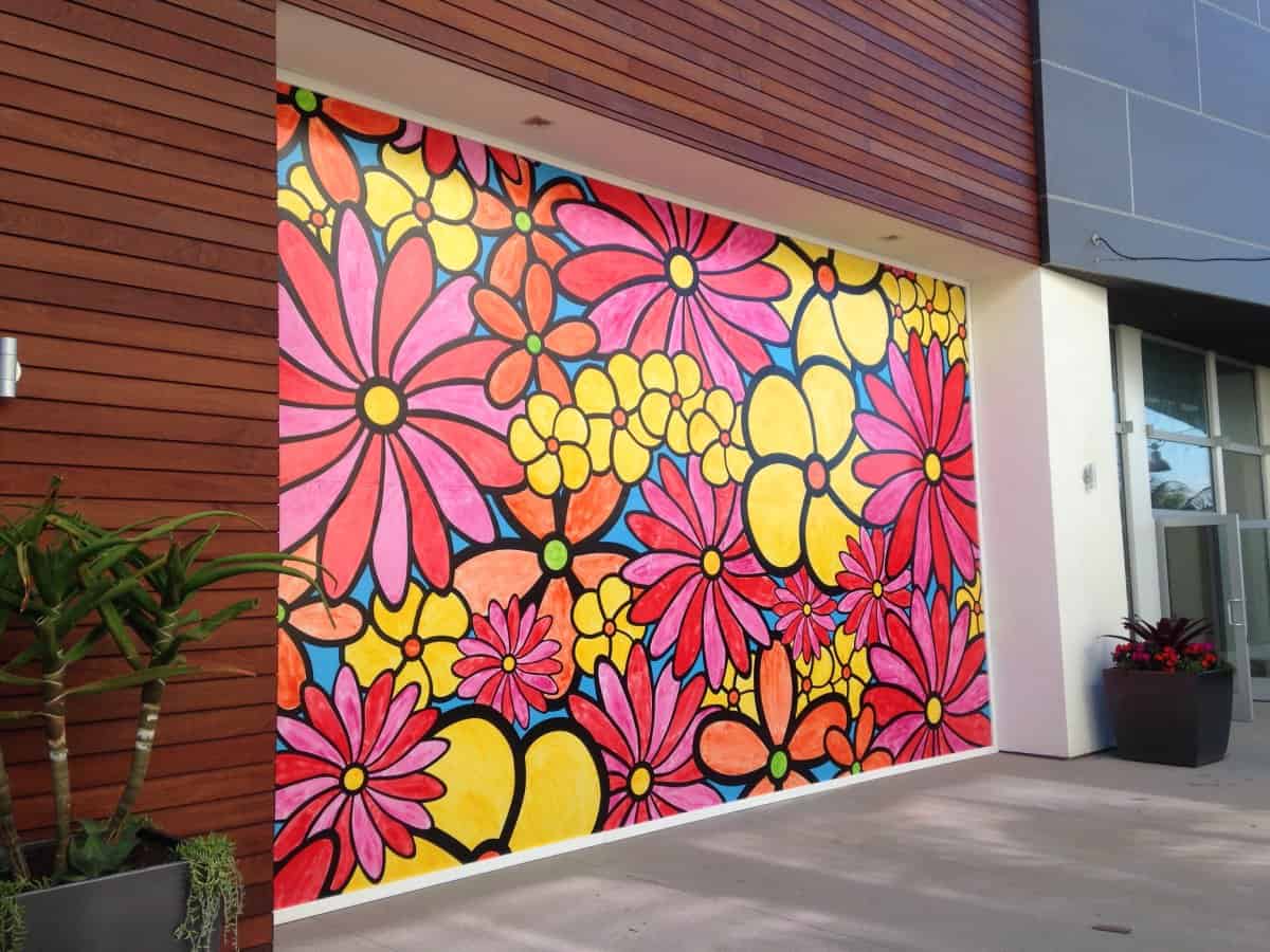 IMG_7332 a painting of flowers on the side of a building.