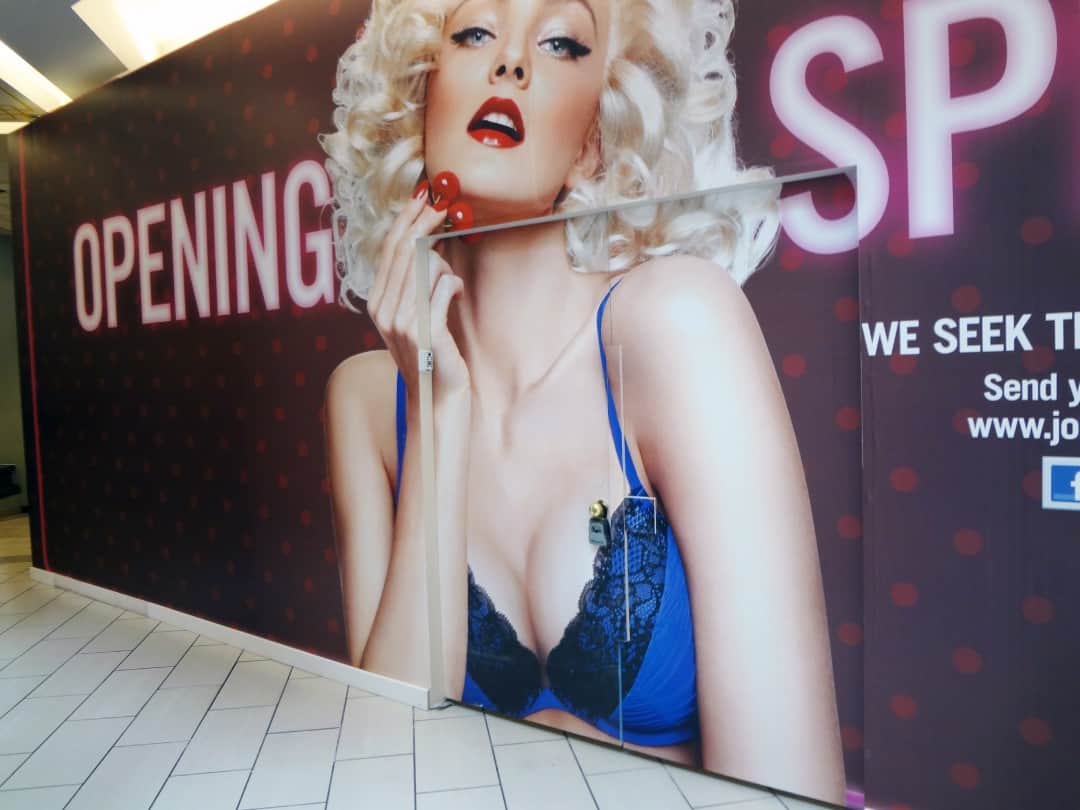 a large advertisement of a woman in lingerie.