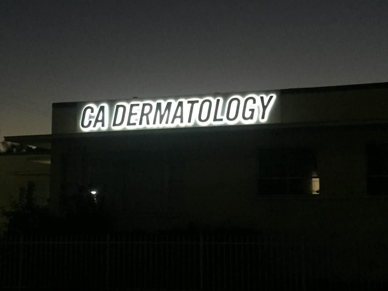 IMG_0655 a building with a sign that reads ga dermatology.