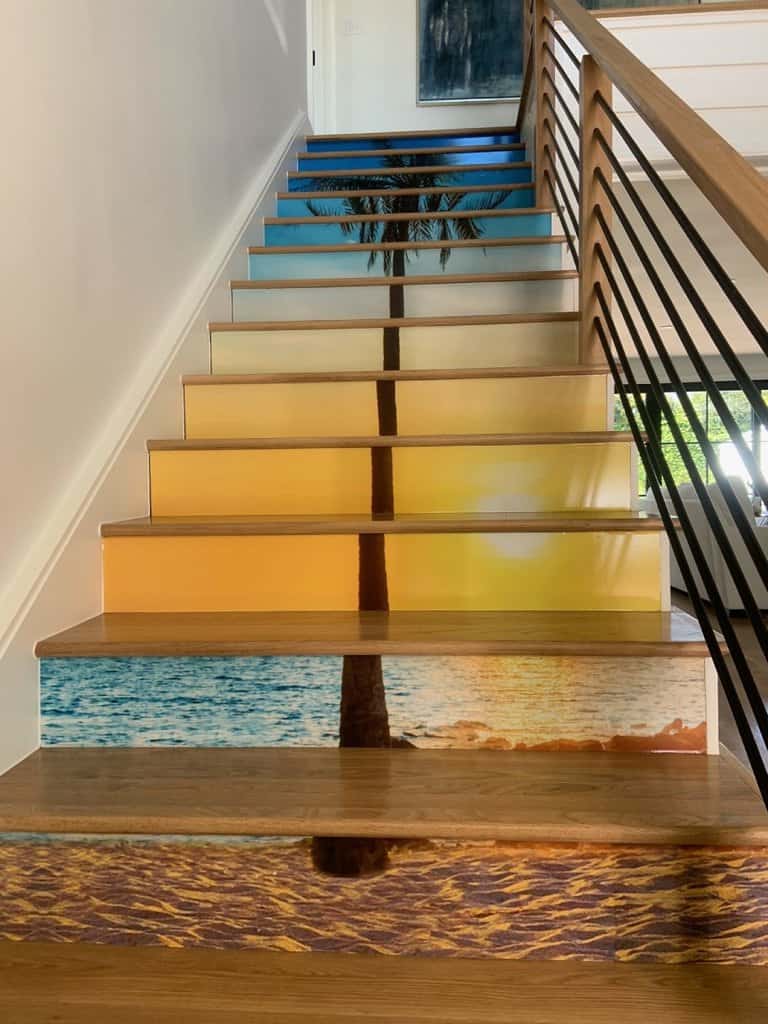 Stair Graphics a set of stairs with a palm tree painted on them.