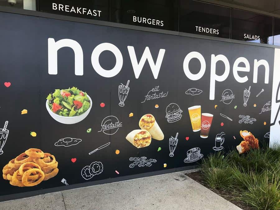 Fantastic Barricade 52 a sign that says now open with a bunch of food on it.