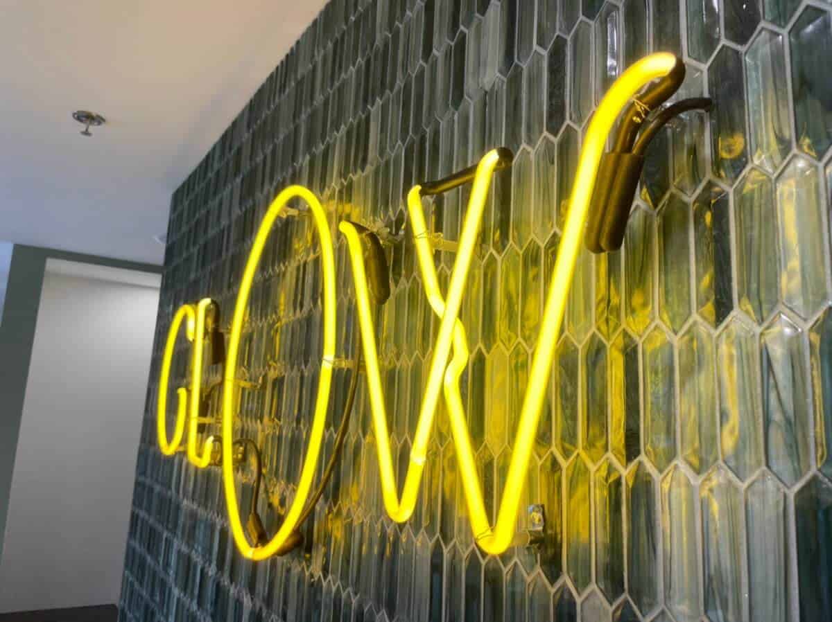 a neon sign on the wall of a building.