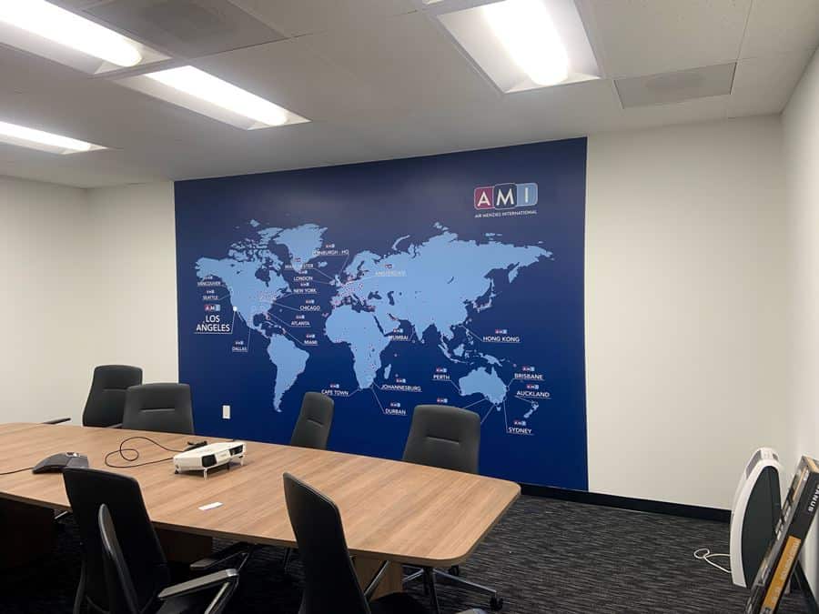 Mural2 a conference room with a map of the world on the wall.
