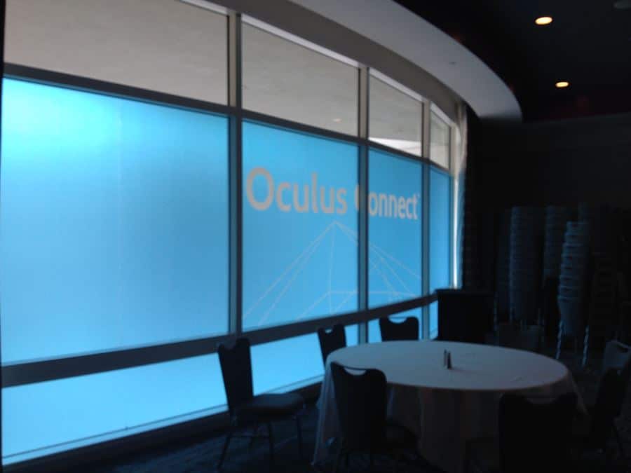 Oculus Window a conference room with a round table and chairs.