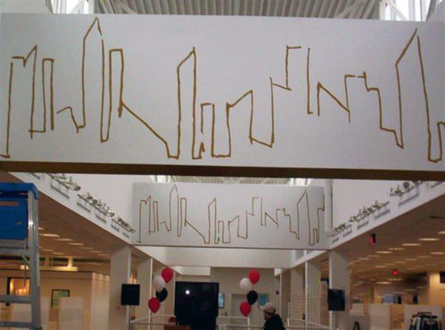 The LTD Wallpaper a sign hanging from the ceiling of a building.