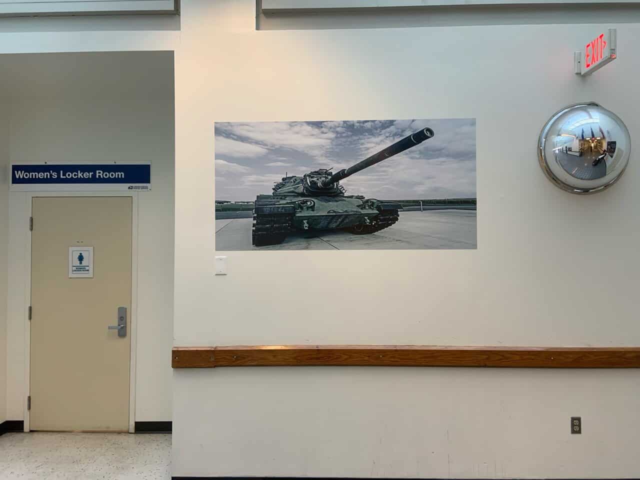 USPS2 a picture of a tank hanging on a wall.