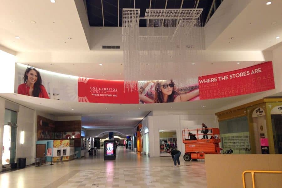lcc north blkhd 02 a shopping mall with a large advertisement hanging from the ceiling.