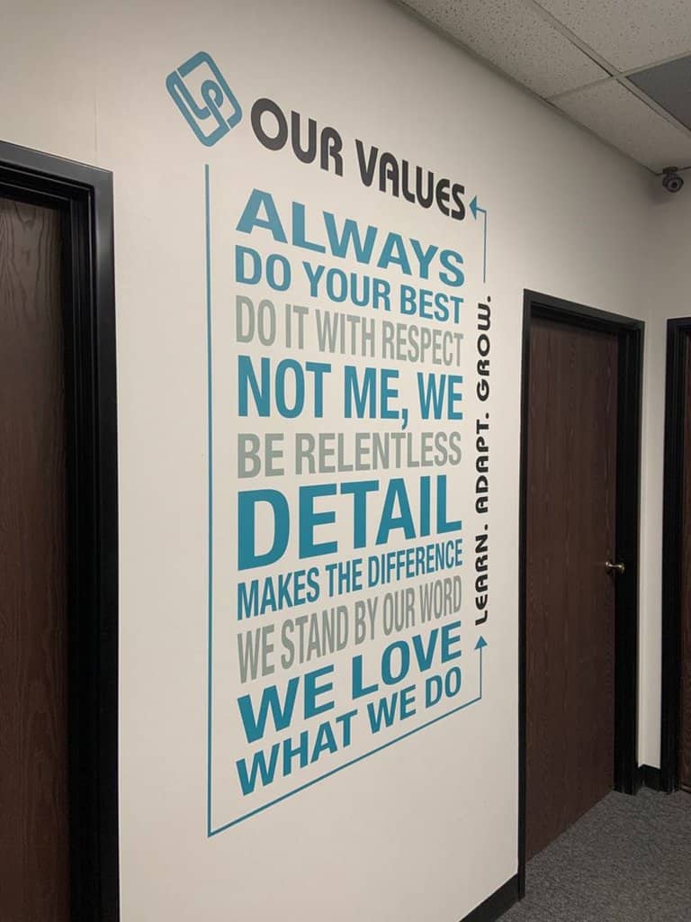 values2 a hallway with a sign on the wall.