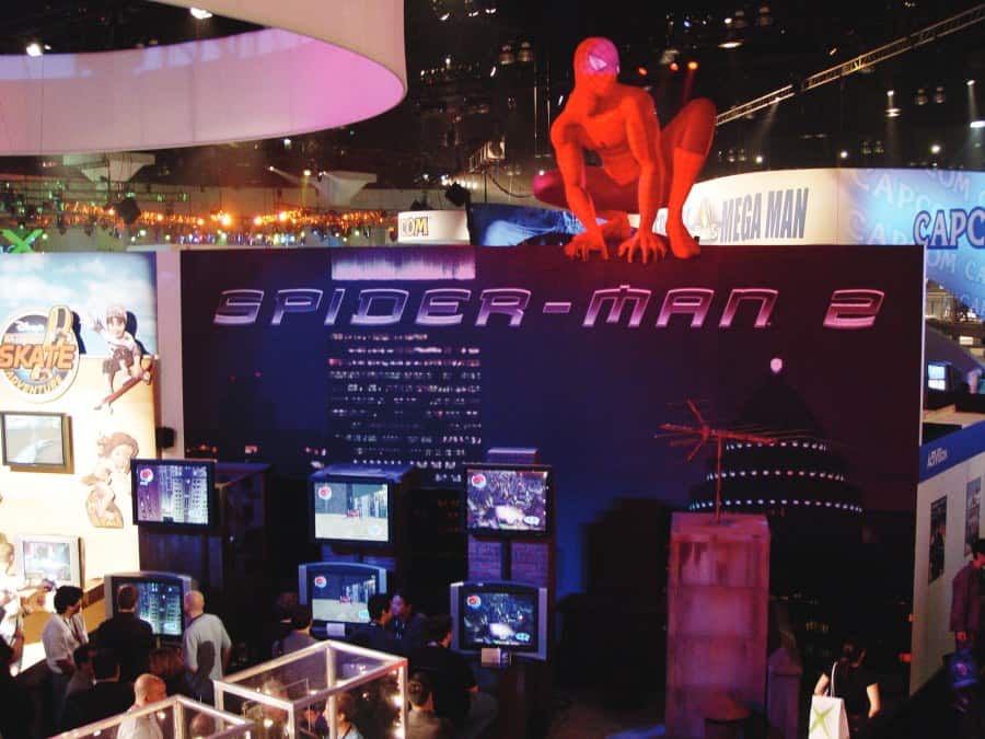 E3_Sman2 a group of people standing in front of a display.
