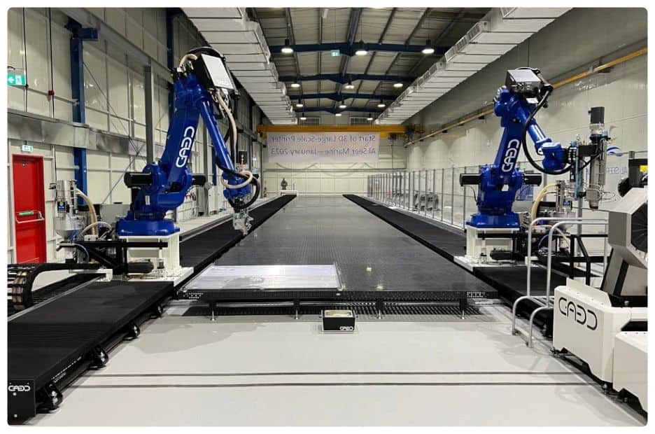 a factory with a conveyor belt and robotic arms.