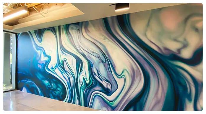 a room with a large painting on the wall.