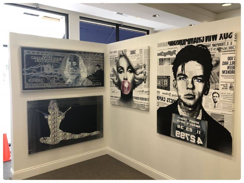 a wall with a bunch of posters on it.