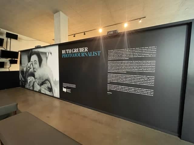 A black wall with an image of a man and a woman. A black wall with an image of a man and a woman.